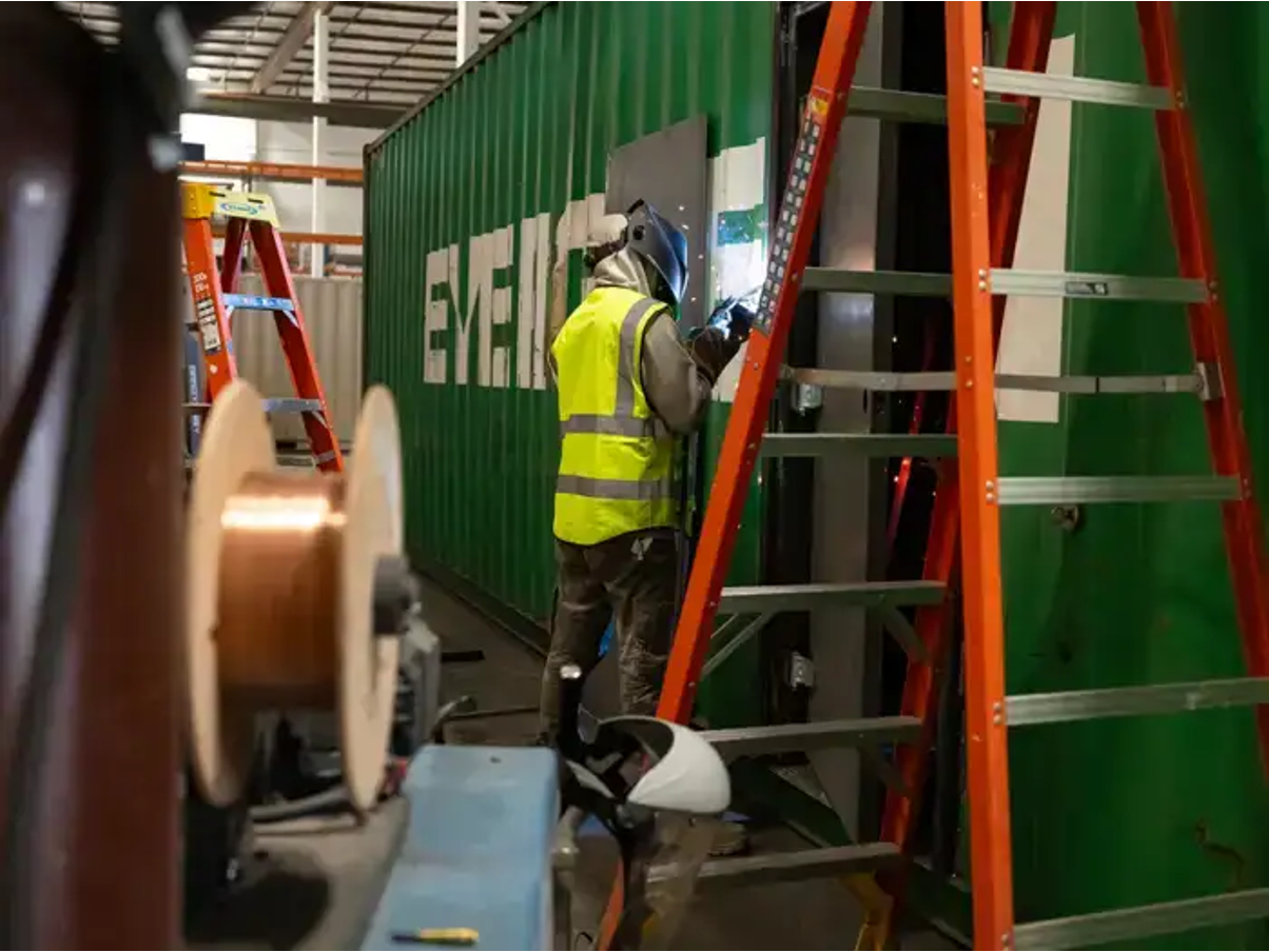 Conexwest team modifying a container. 