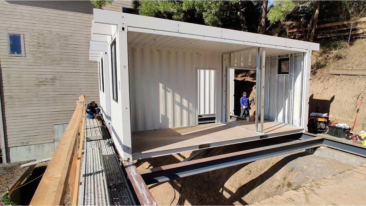 Conexwest team prepping a container home site. 