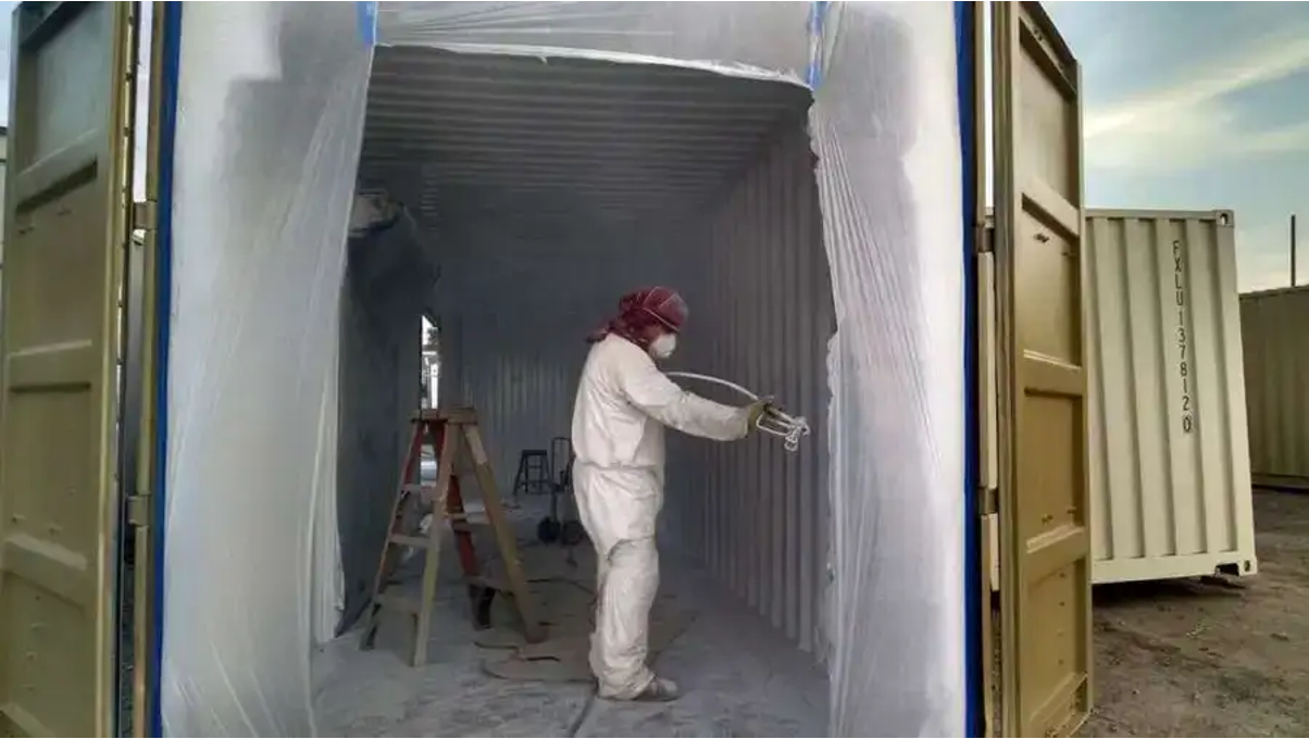 Conexwet team painting a container. 