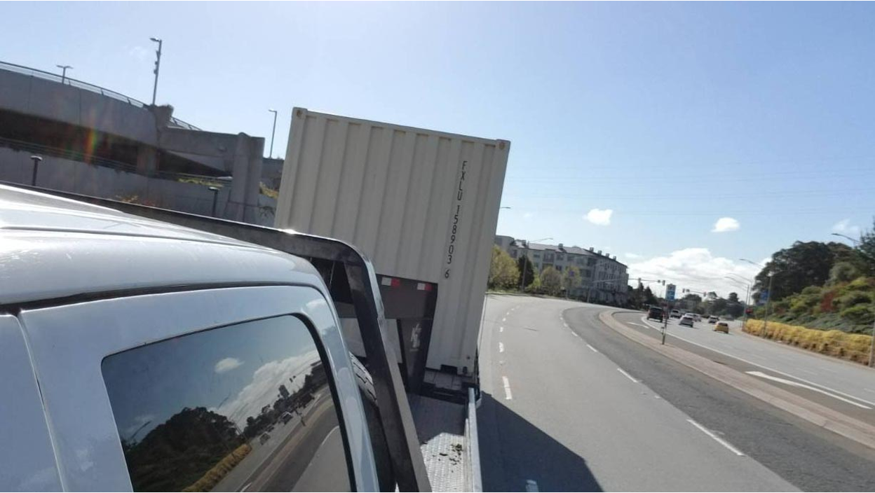 Container being transported by a truck