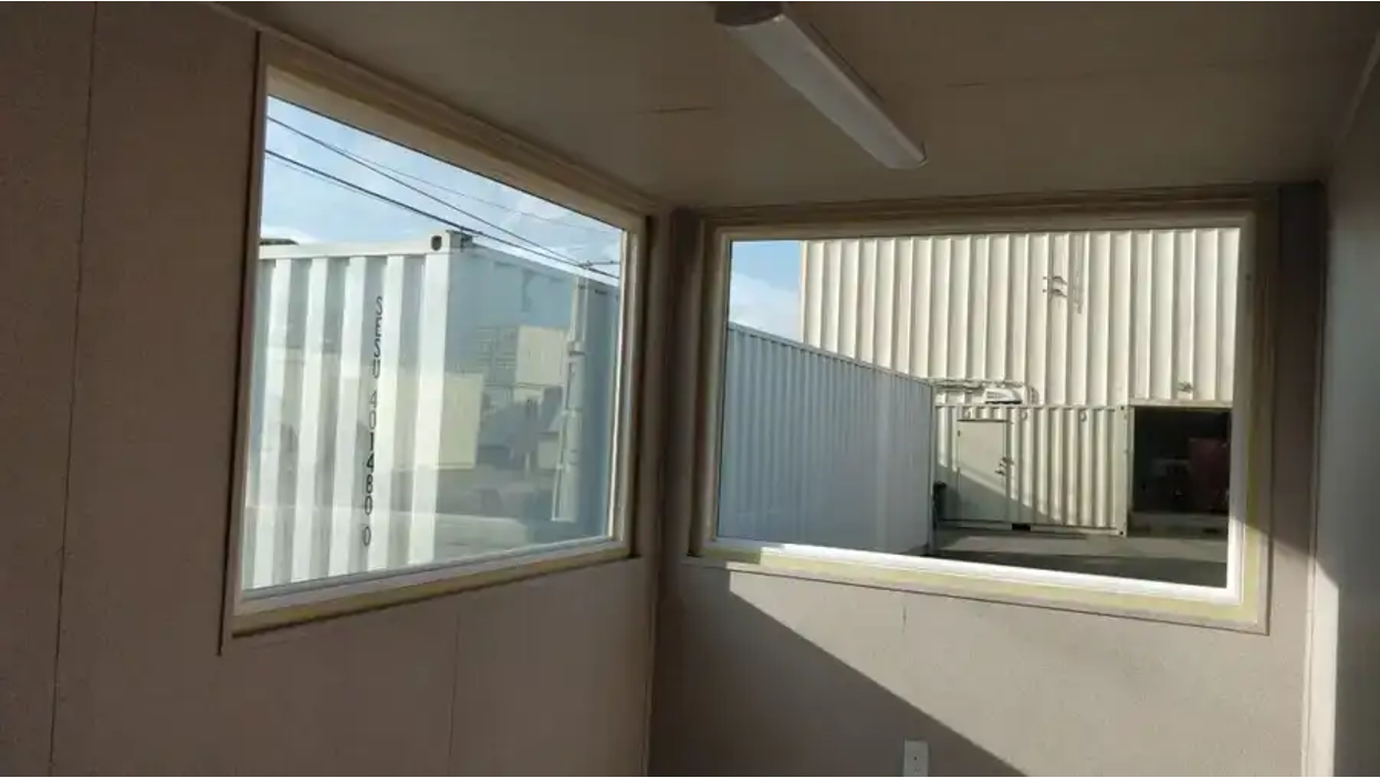 Double-pane picture window for shipping containers.
