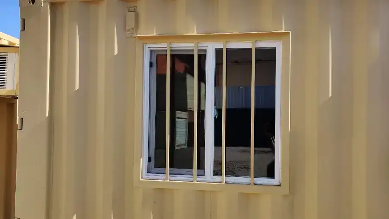 Double-pane sliding windows for shipping containers.