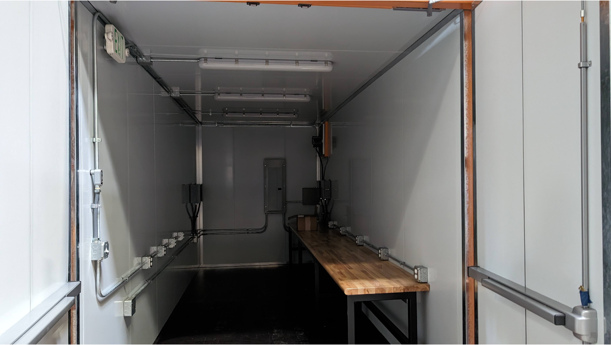 Interior of a modified container showing some electrical modifications.