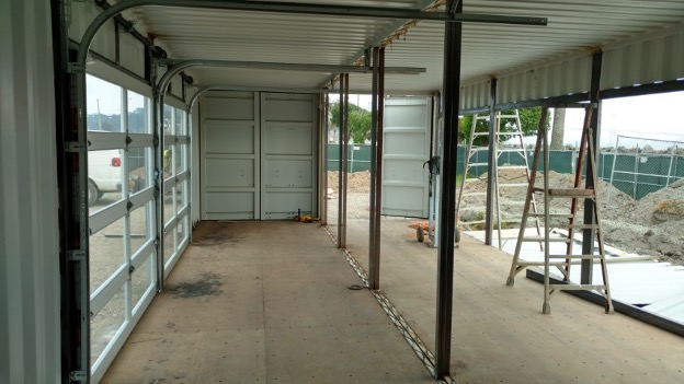 Interior view of a modified shipping container under construction.