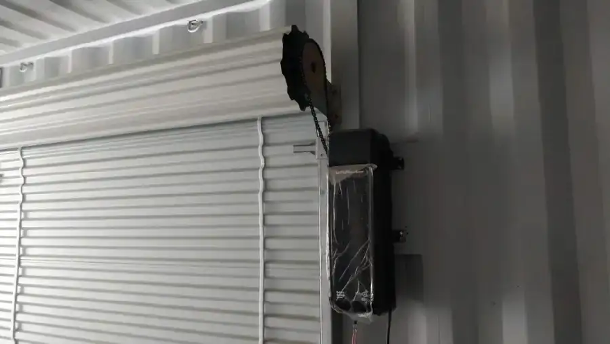Powered roll-up door add-on for shipping containers. 