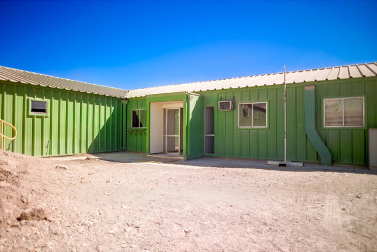 U-shaped container home with central courtyard.