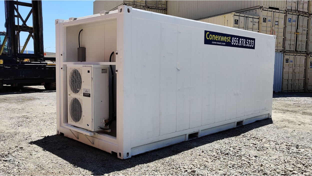White shipping container with dual external air conditioning units mounted on the side.