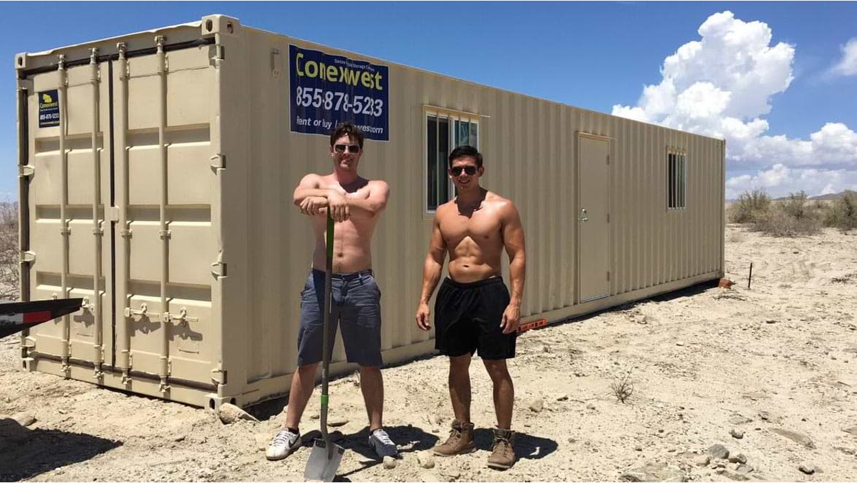 Workers in front of a container 