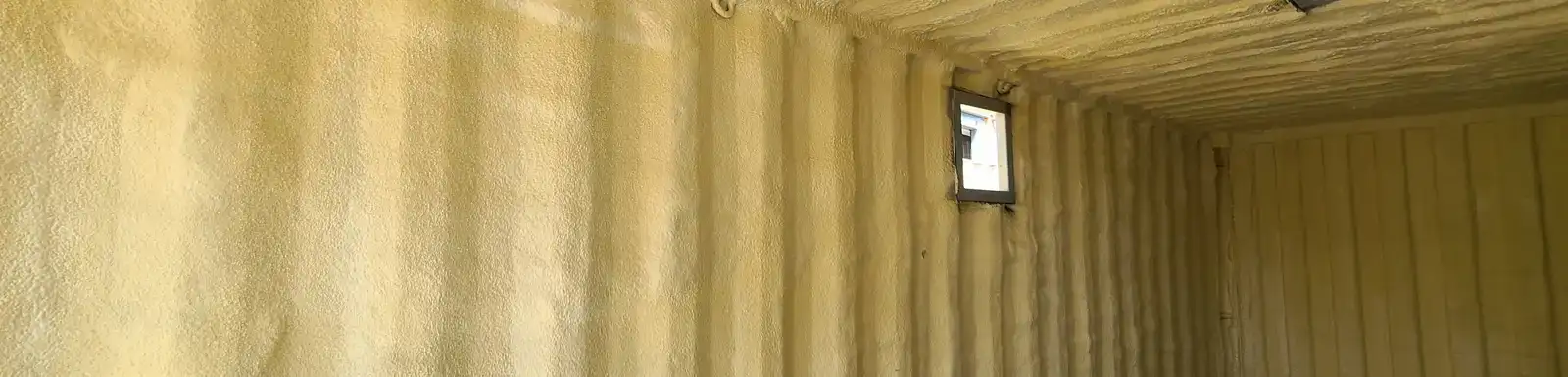 Insulation inside a modified shipping container