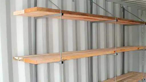 Removable shelving system for shipping containers for rent