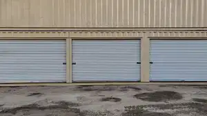 three 12ft roll up doors in beige 40ft shipping container